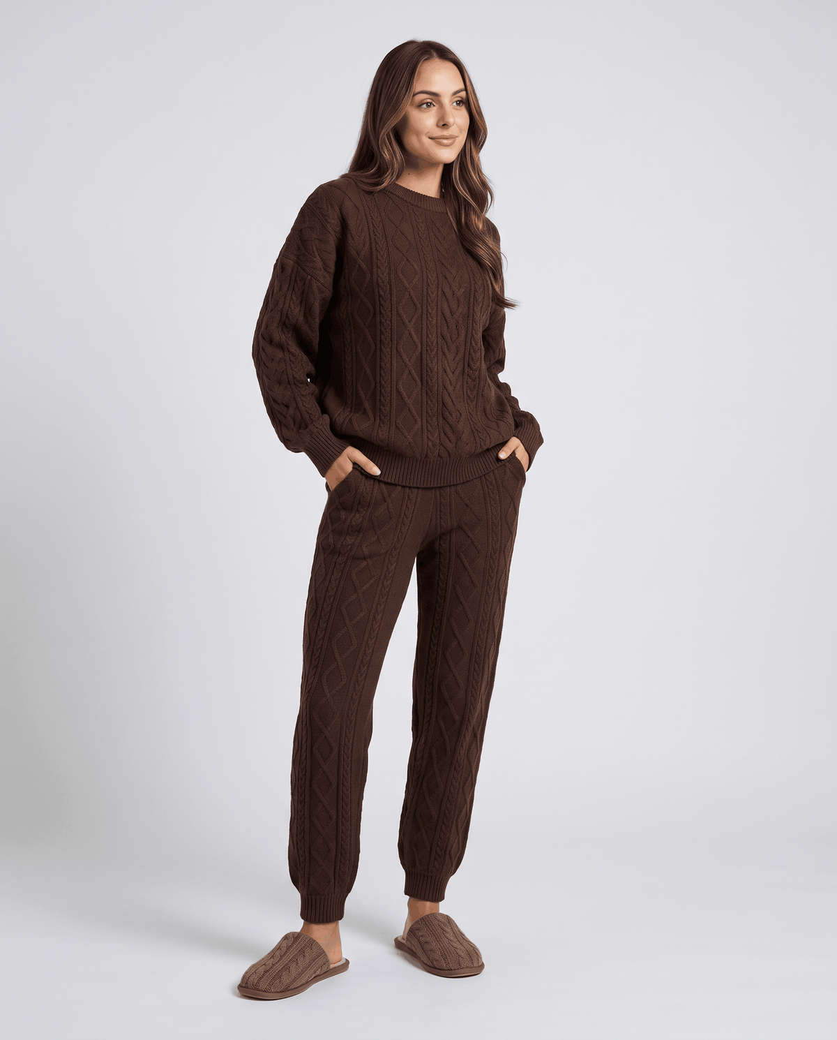 Woman wearing a brown cable knit loungewear set with crew neck sweater and jogger pants