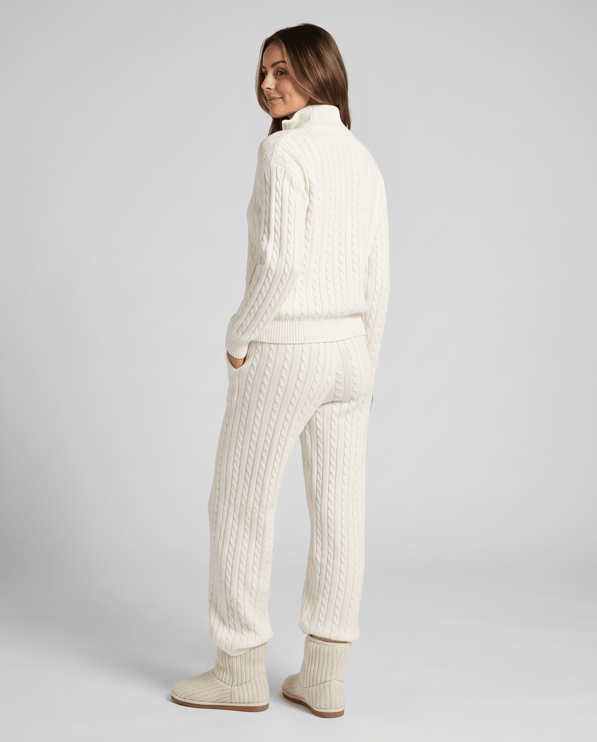 Off-white cable-knit loungewear set, back view with hands in pants pockets