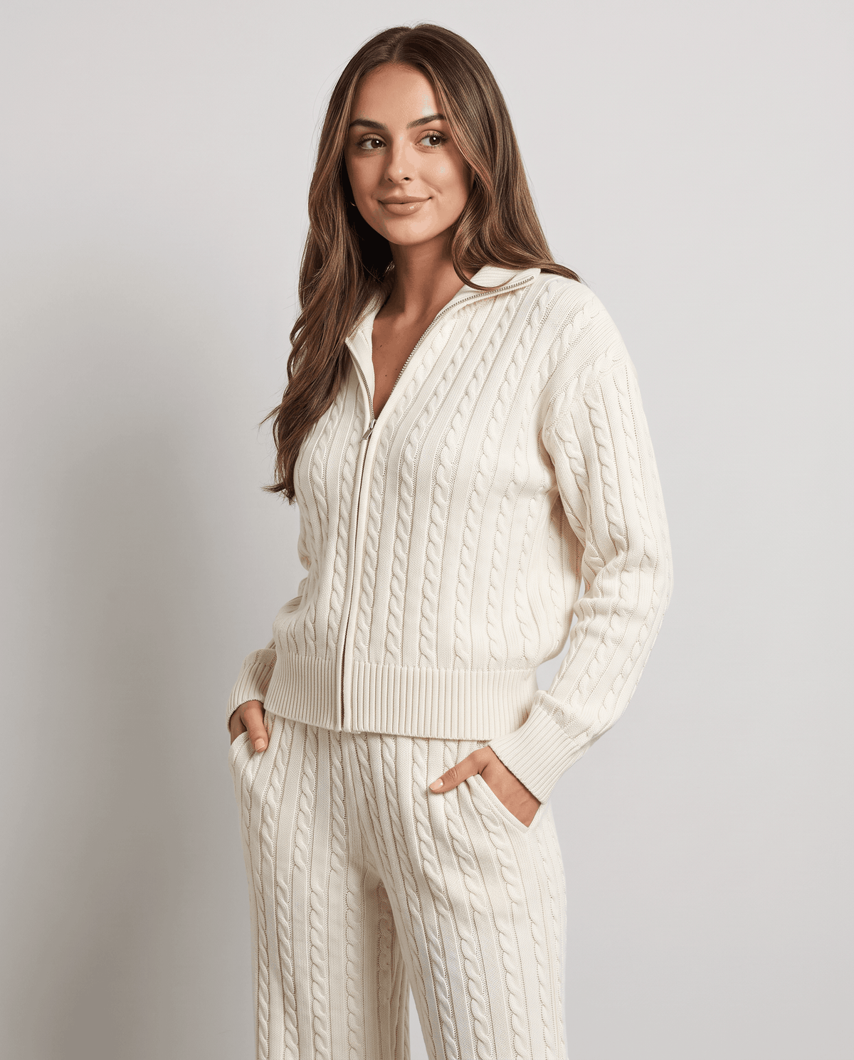 Off-white cable-knit zip-up jacket and pants loungewear set, three-quarter front view