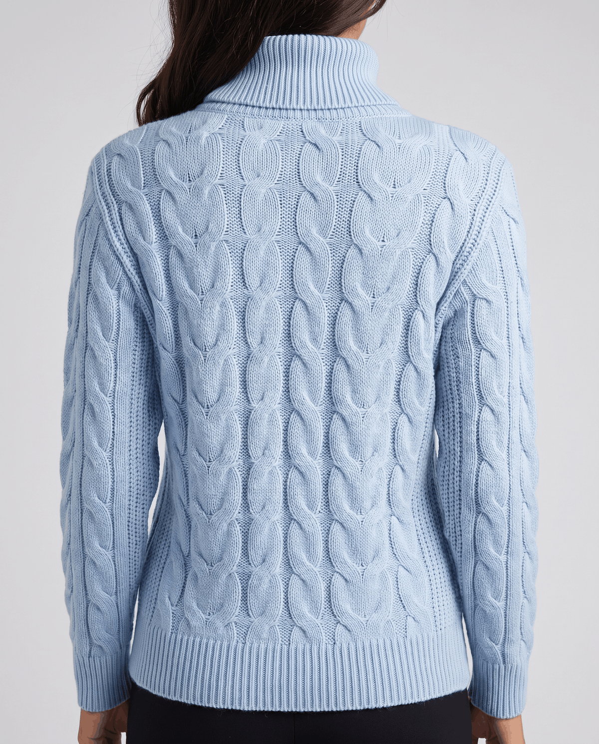 Back view of the sky blue knit showing cable panels from collar to hem