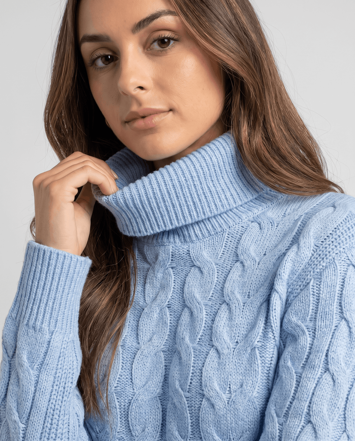 Close-up of the sky blue fold-over neck as she lifts the collar