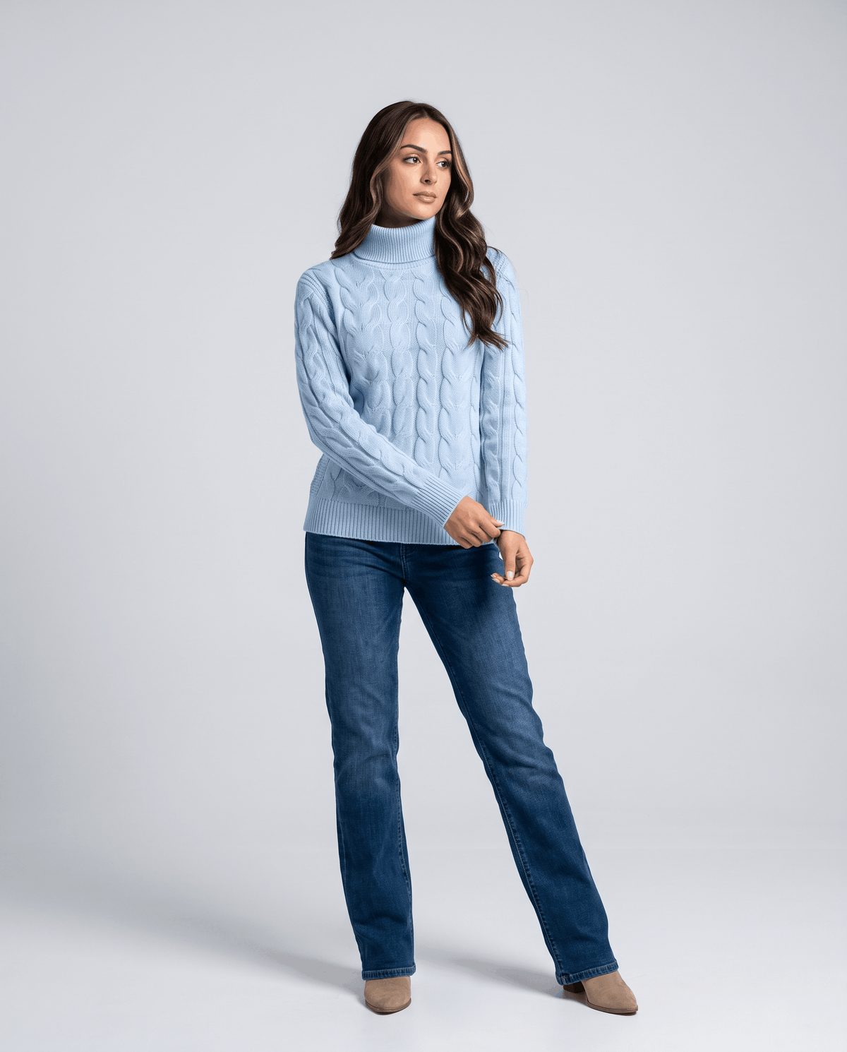 Full-length sky blue turtleneck outfit with straight-leg jeans and light shoes
