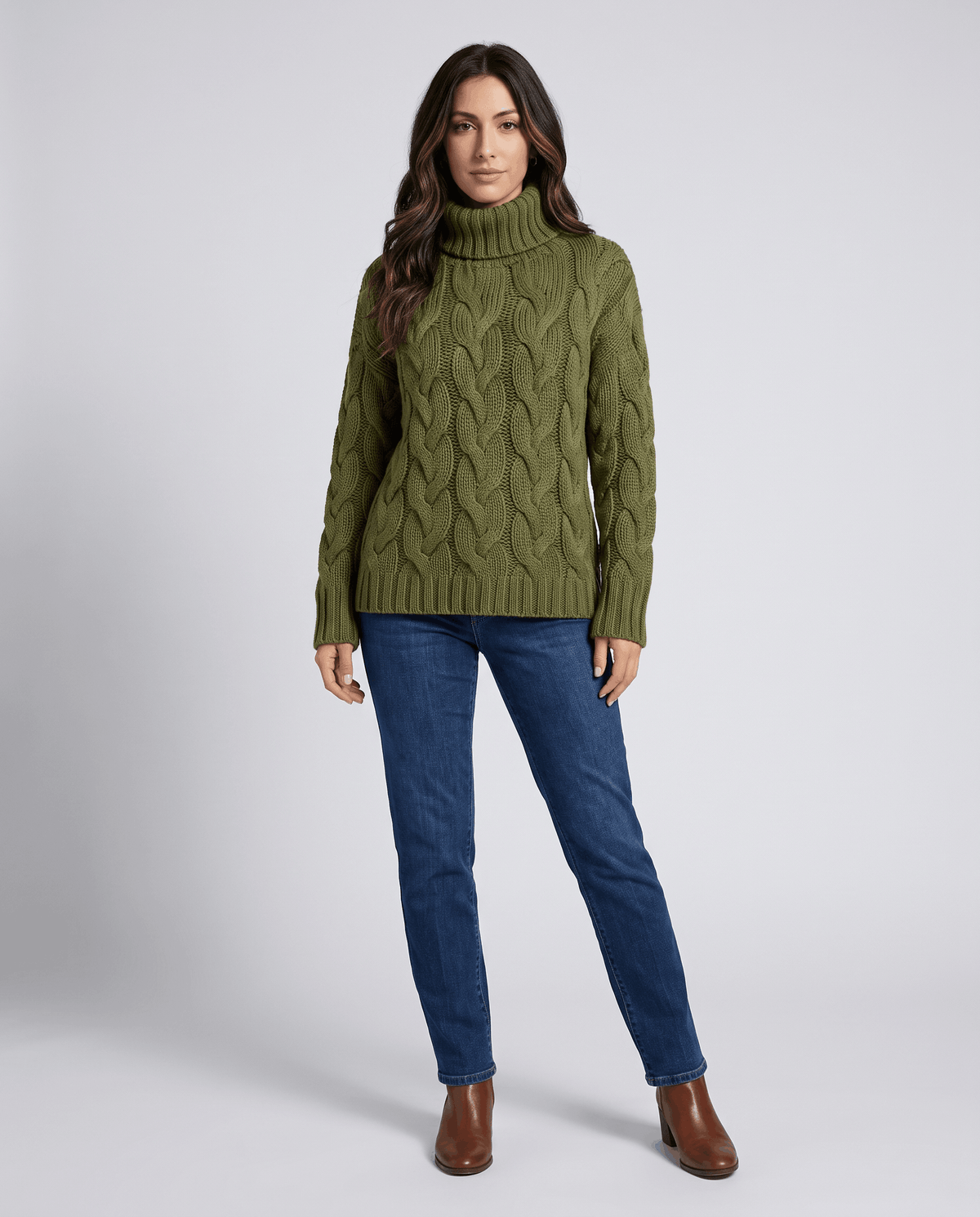 Full-length view of olive green turtleneck with dark jeans and ankle boots
