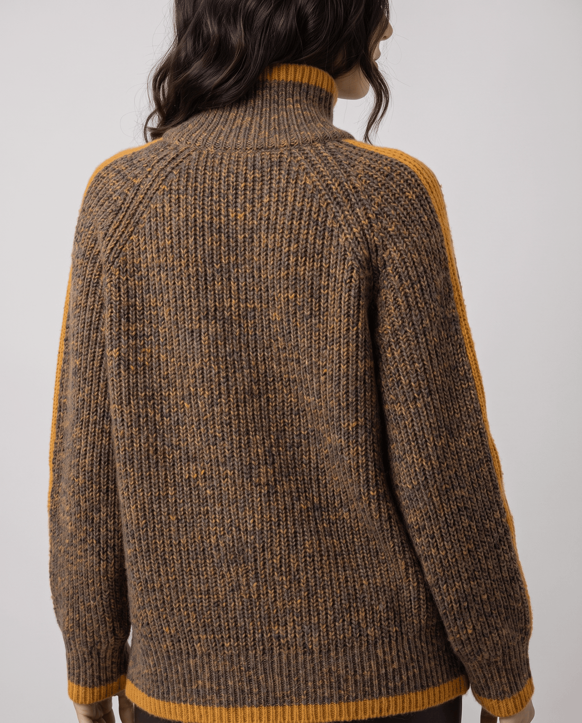 Back view of brown turtleneck sweater with mustard trim at collar, cuffs and hem