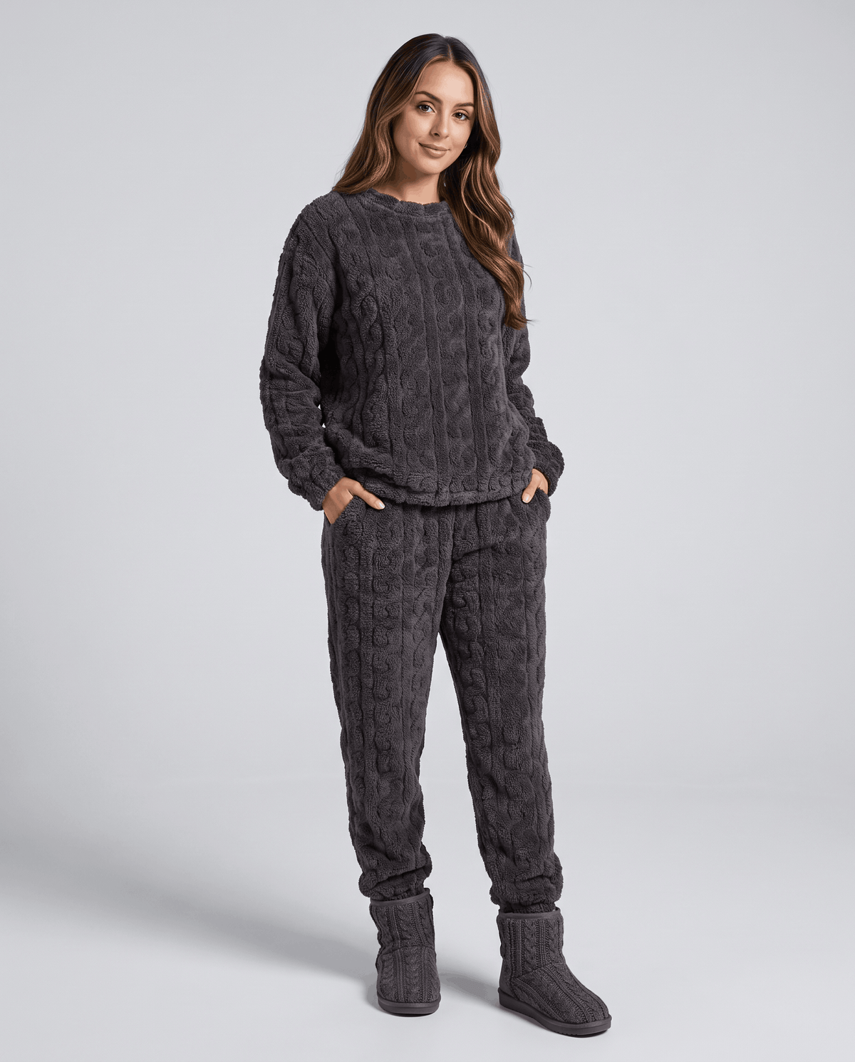 Woman wearing a charcoal plush jacquard top and matching jogger pants