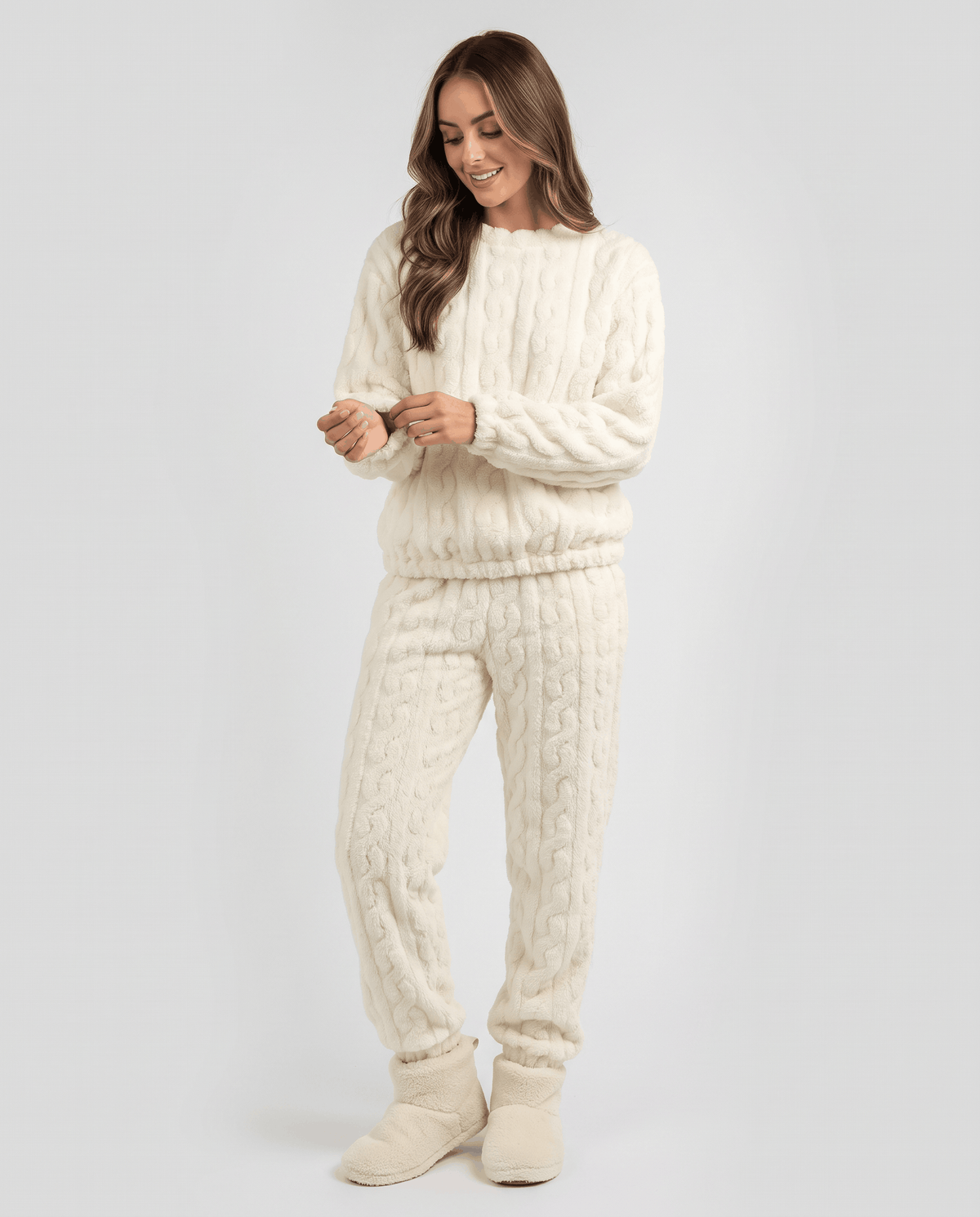 Front view of woman in cream plush jacquard top and matching jogger pants