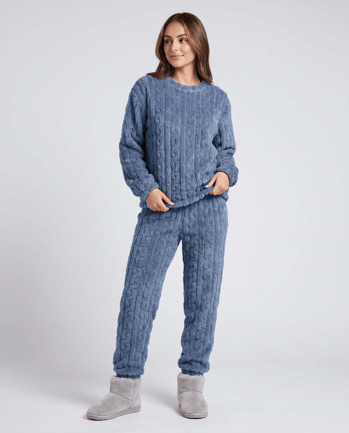 Woman wearing a denim blue plush jacquard top and matching jogger pants
