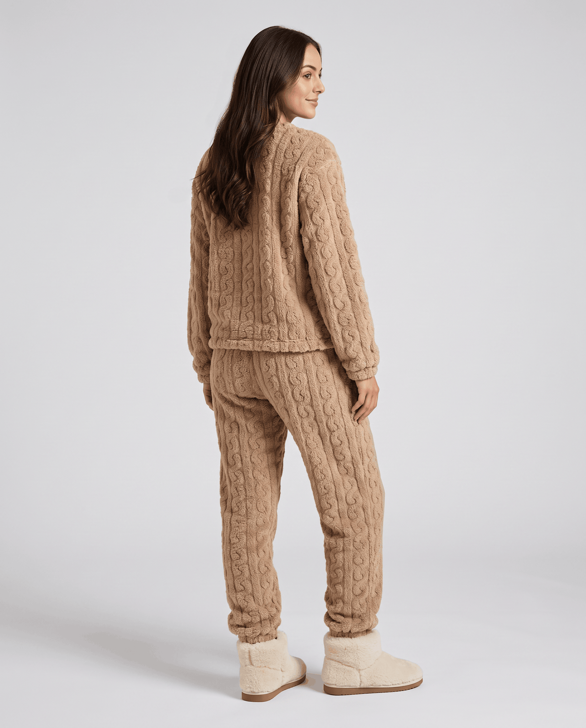 Back view of woman in tan plush jacquard top and matching jogger pants