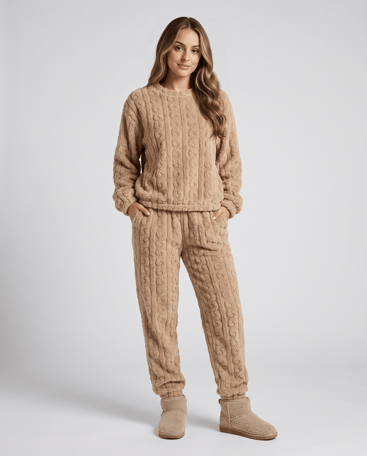 Woman wearing a tan plush jacquard top and matching jogger pants