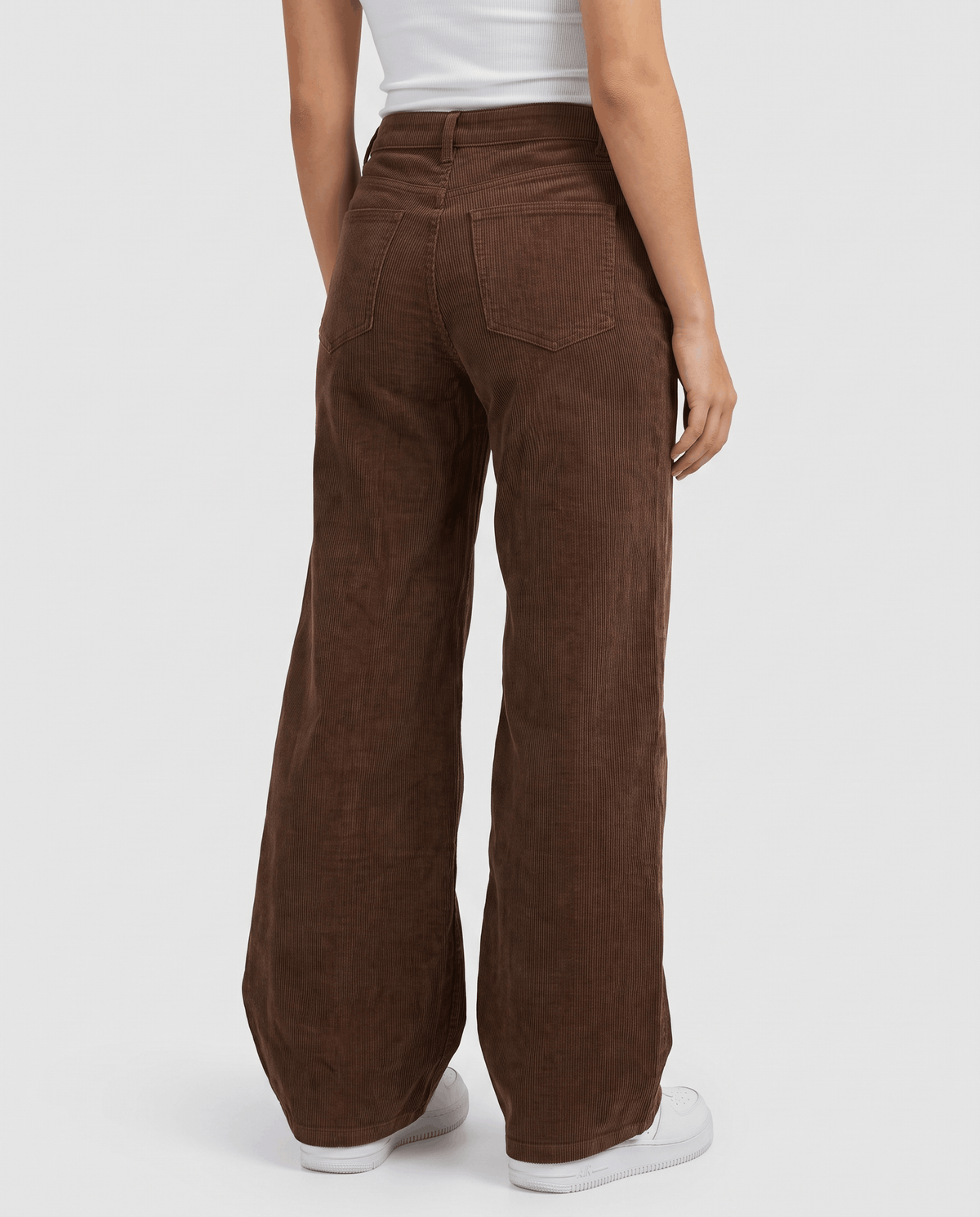 Back view of brown wide-leg trousers showing the patch pockets and full-length hem