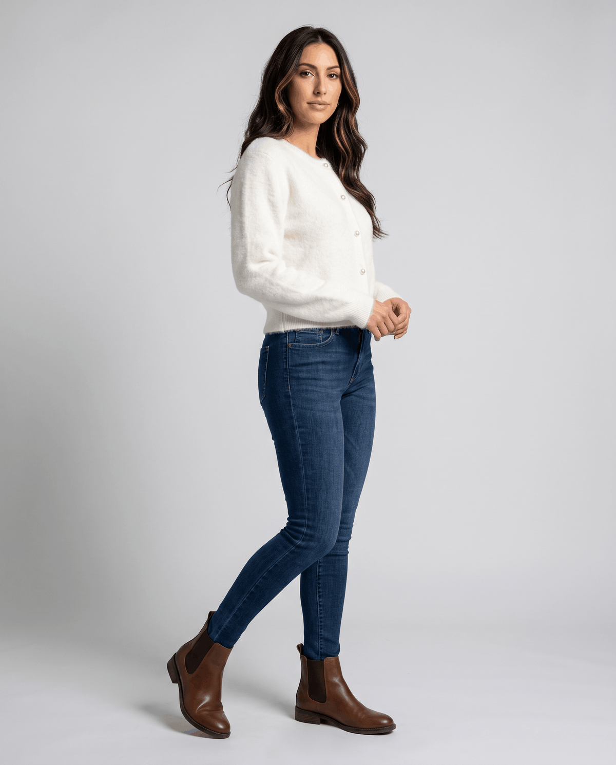 Full-length beige cardigan outfit with skinny jeans and brown ankle boots