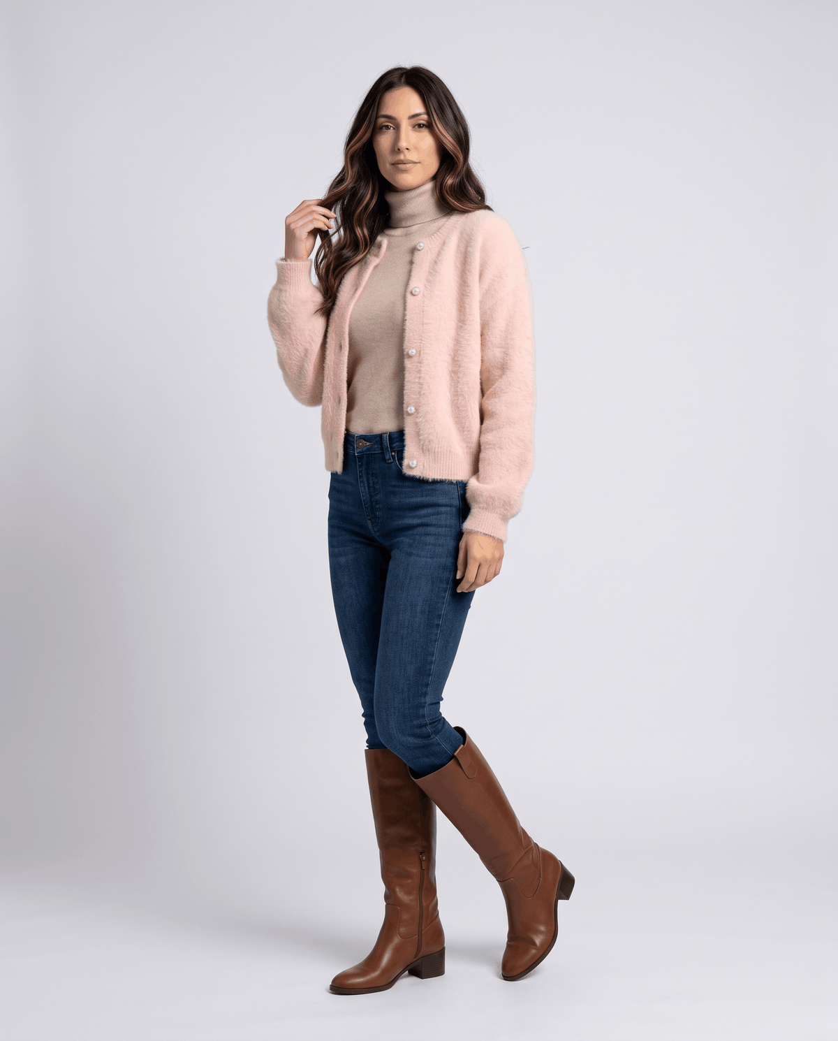 Full-length pink cardigan outfit with jeans and brown knee-high boots