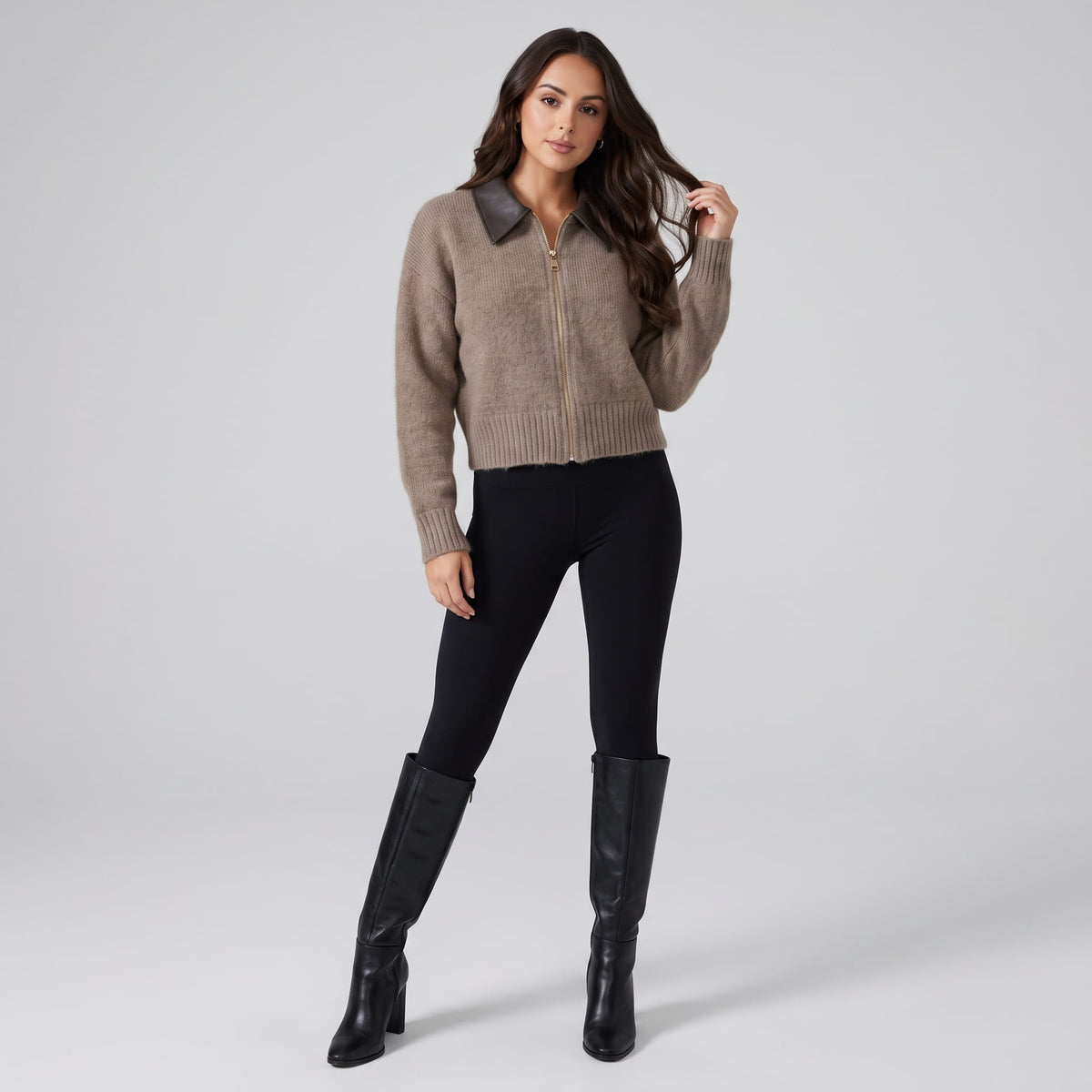 Full-length outfit with black leggings and black knee-high boots