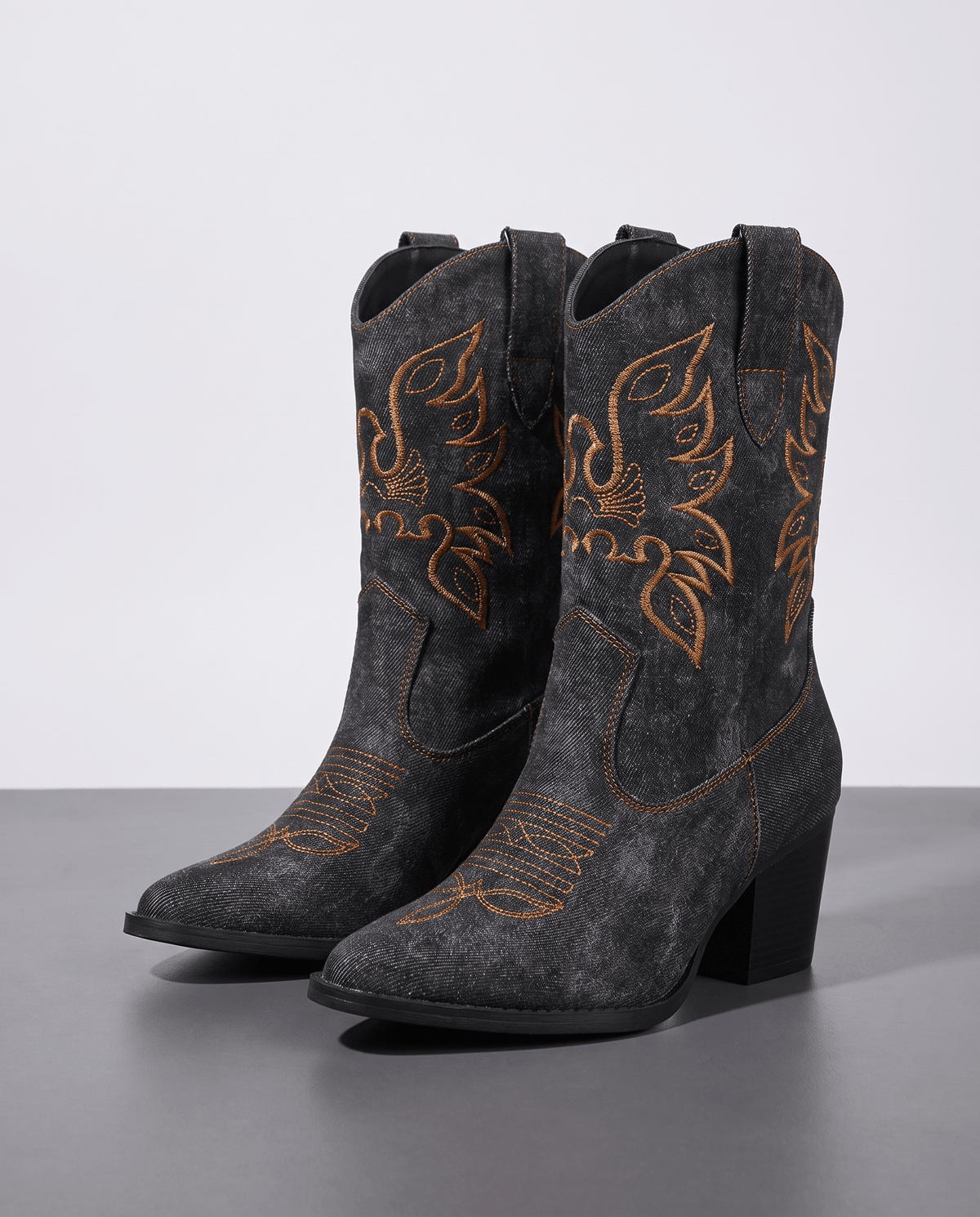 Pair of women's embroidered ankle cowboy boots in black washed denim-look with block heels