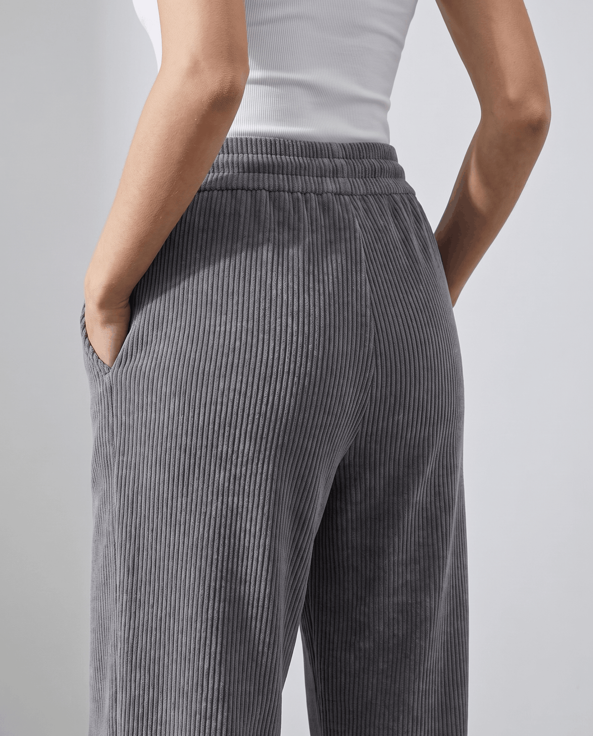 Back close-up of charcoal gray wide-rib corduroy at the hip and elastic waist