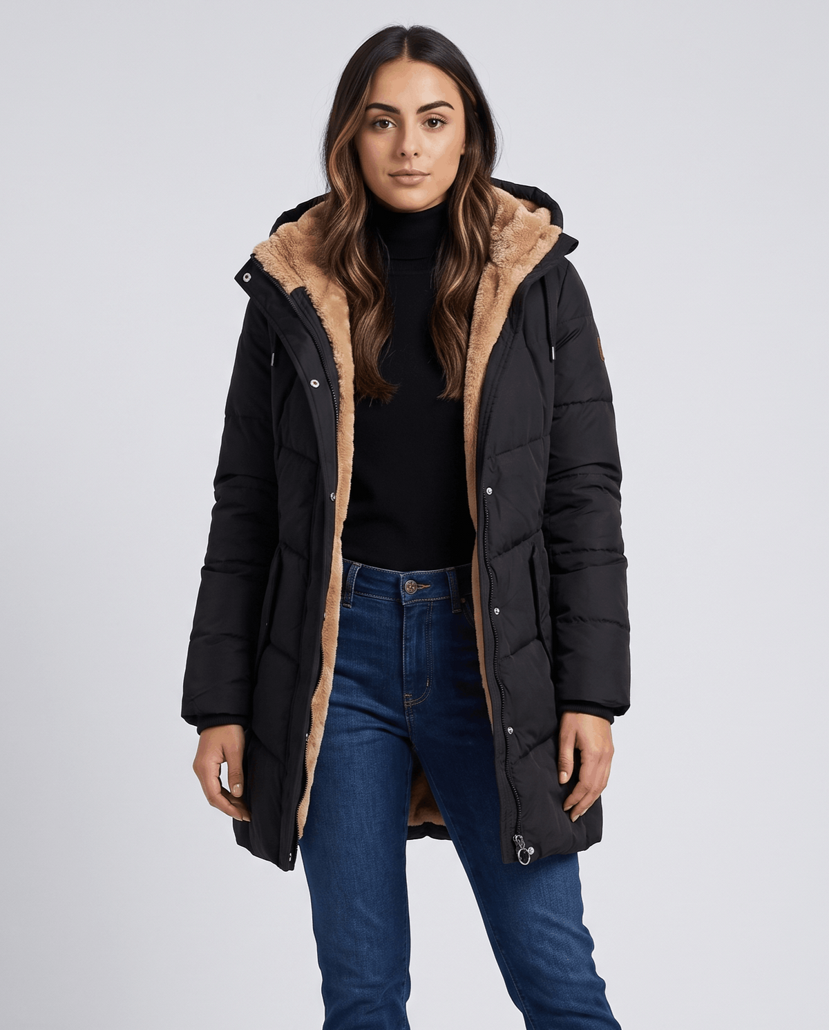 Black parka worn open showing the camel fleece lining inside