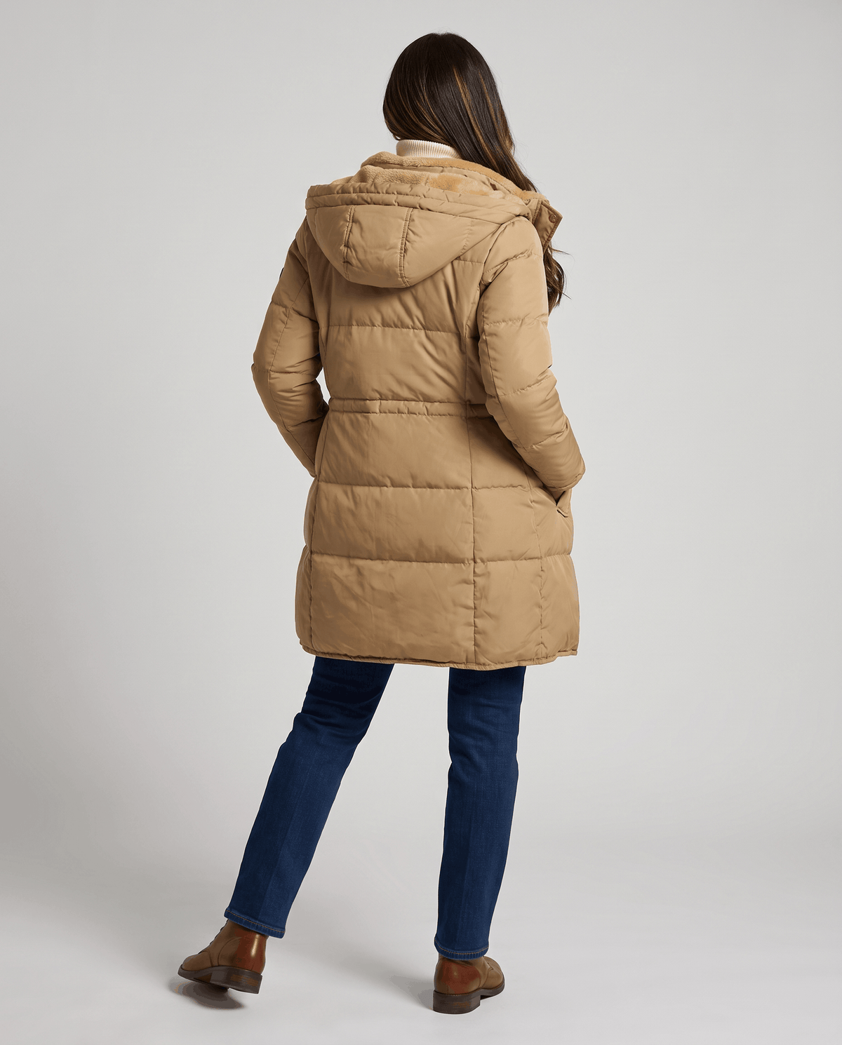 Back view of camel parka with chevron quilting and hood