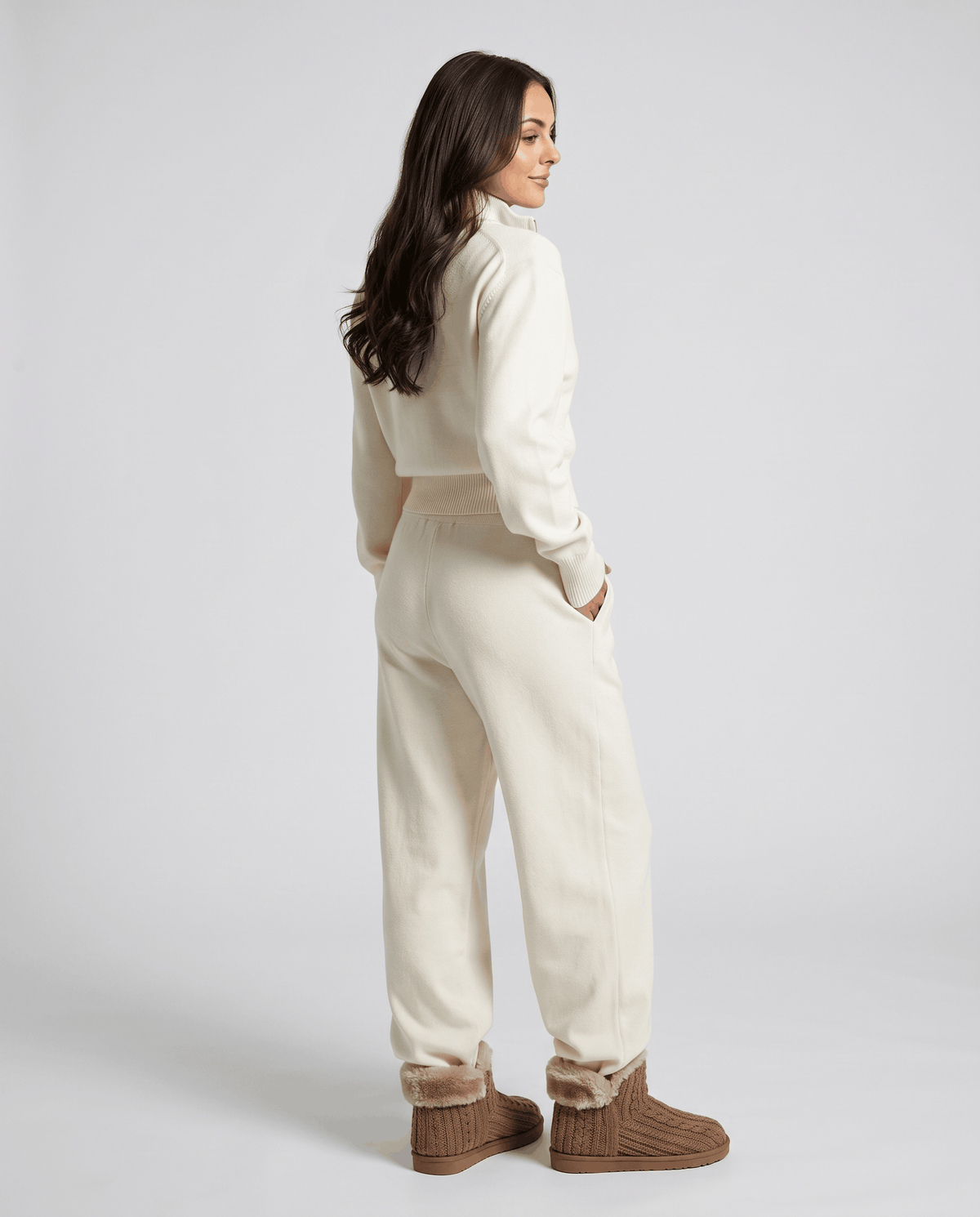Beige knit loungewear set, back view with hands in pants pockets