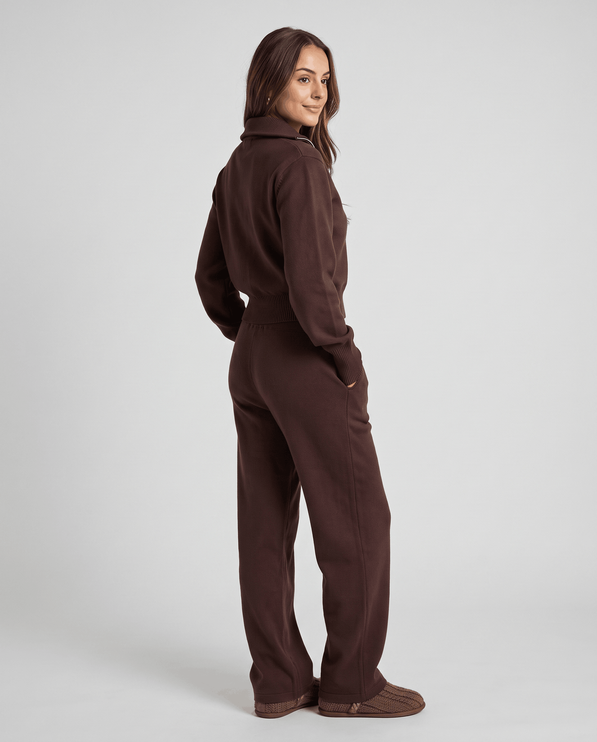 Dark brown knit loungewear set, back view with hand in pocket