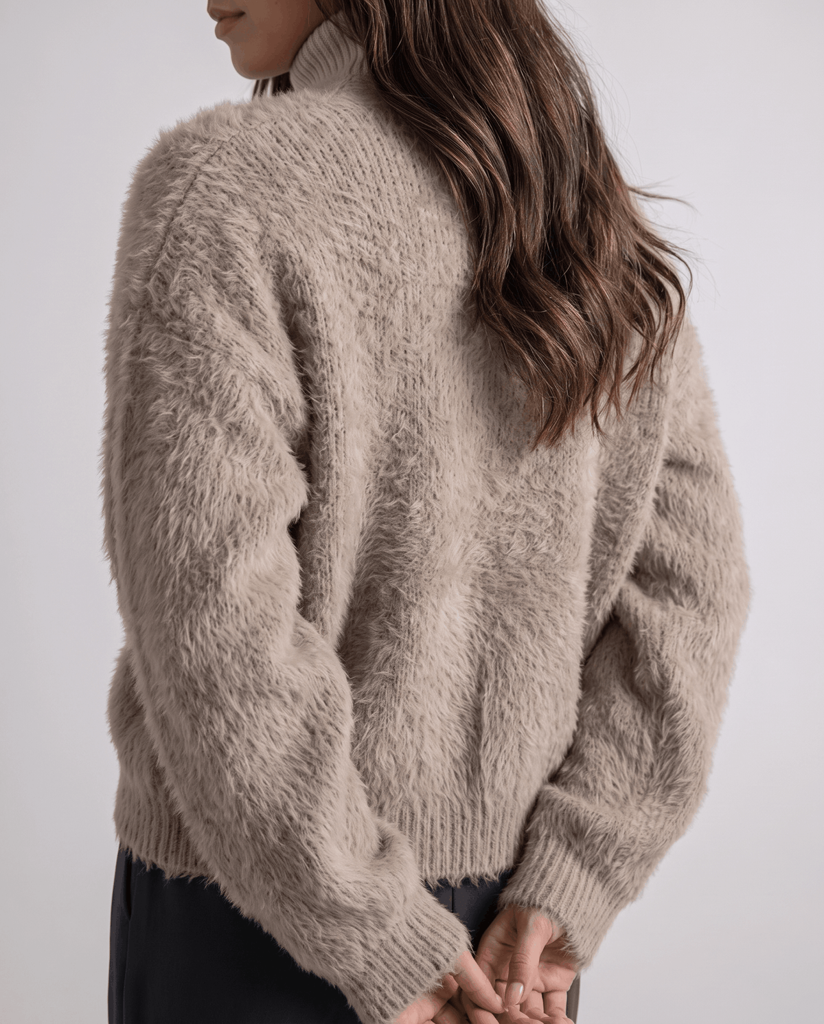 Back view of the taupe cardigan showing the relaxed oversized cut