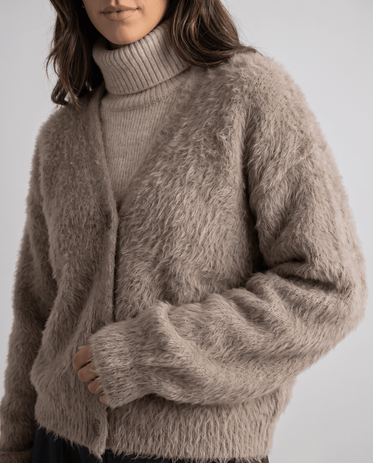 Close-up of the taupe fuzzy knit and button front over a turtleneck