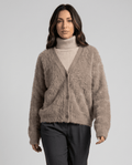 Women's fuzzy button-down cardigan in taupe over a cream turtleneck with gray pants