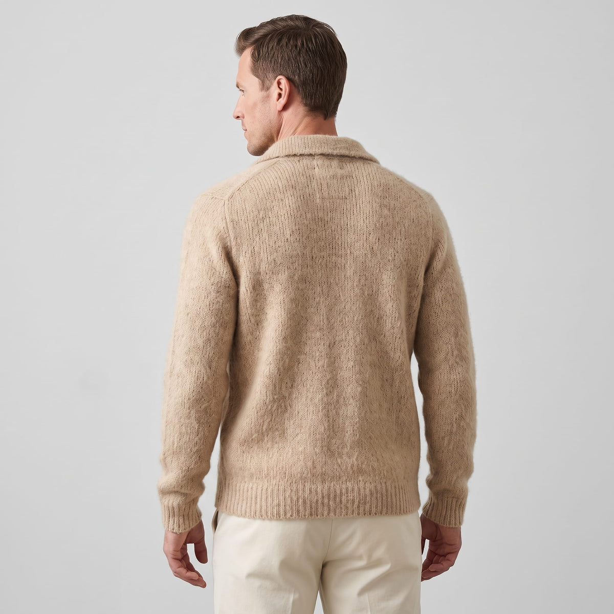 Back view of the khaki cardigan showing the collar and ribbed hem