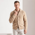 Men's fuzzy collared cardigan in khaki buttoned up with white trousers