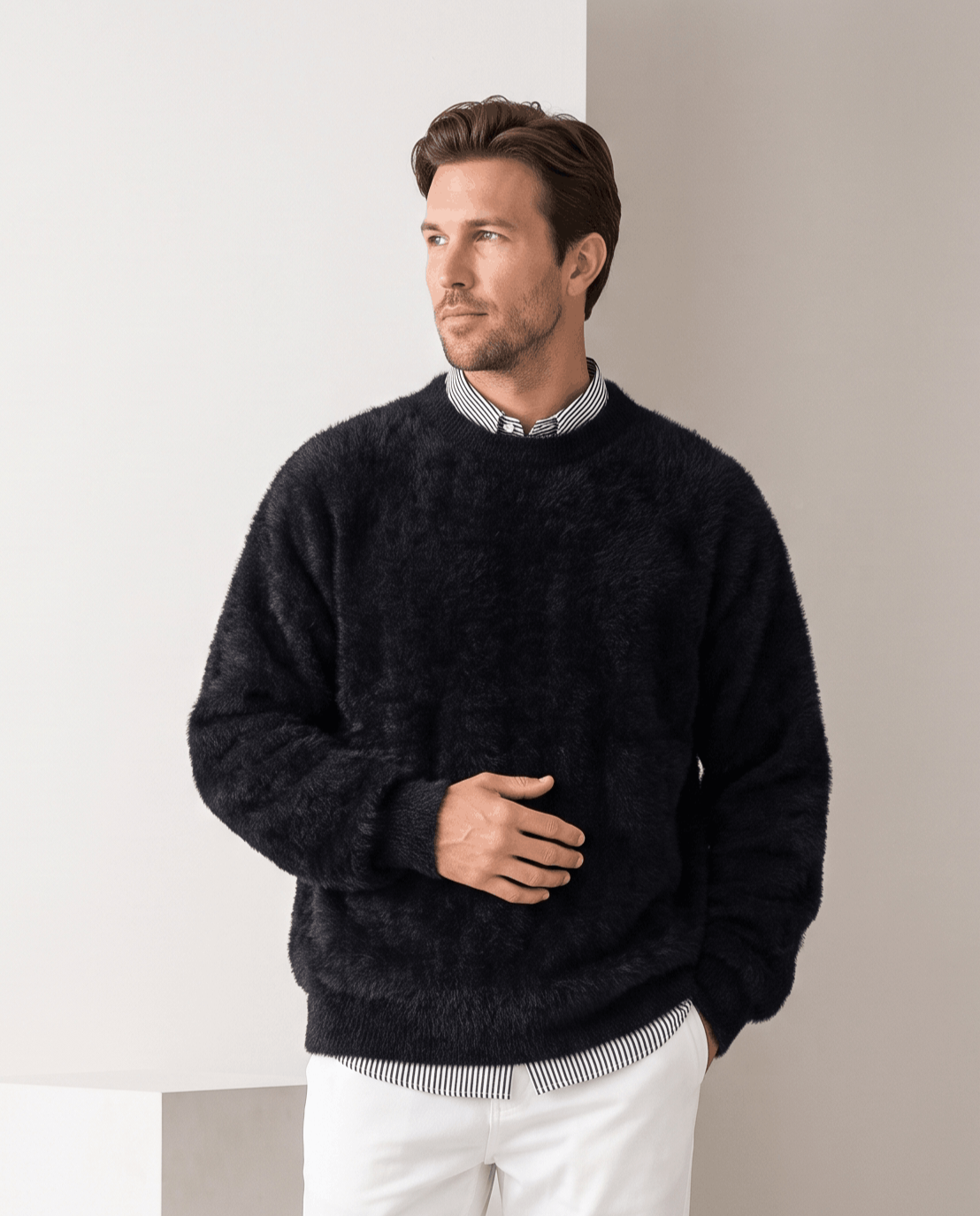 Black pullover over a collared shirt with white trousers