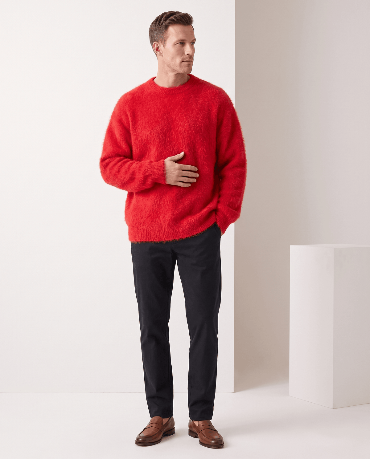 Full-length look with the red pullover, black trousers and brown leather shoes