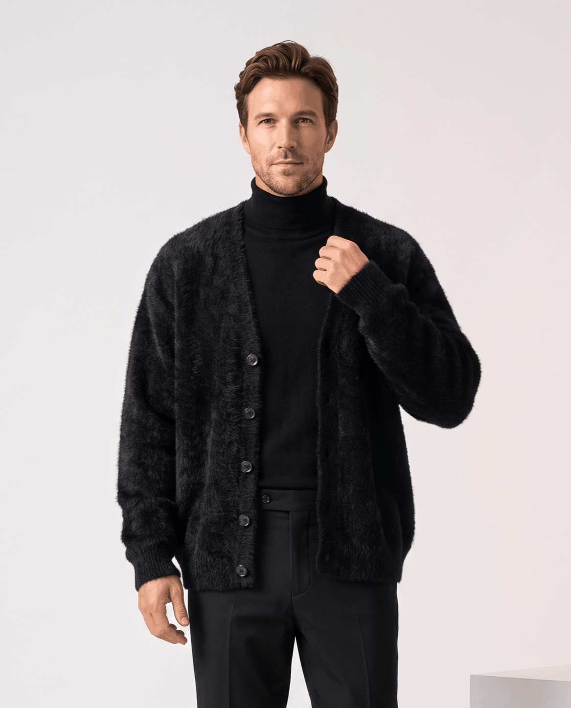 Men's fuzzy V-neck cardigan sweater in black over a black turtleneck