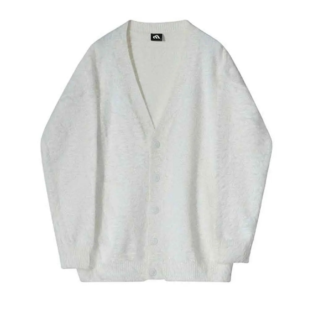 Flat-lay of the white V-neck cardigan buttoned on a plain background