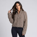 Women's fuzzy zip-up cardigan sweater in taupe with navy leggings
