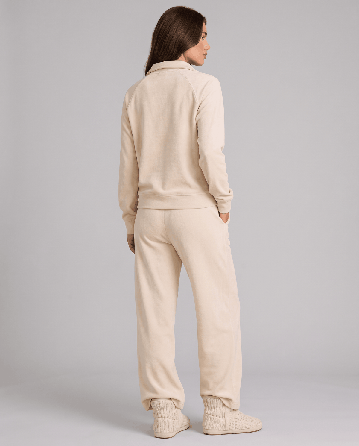 Back view of beige long-sleeve top and wide-leg pants