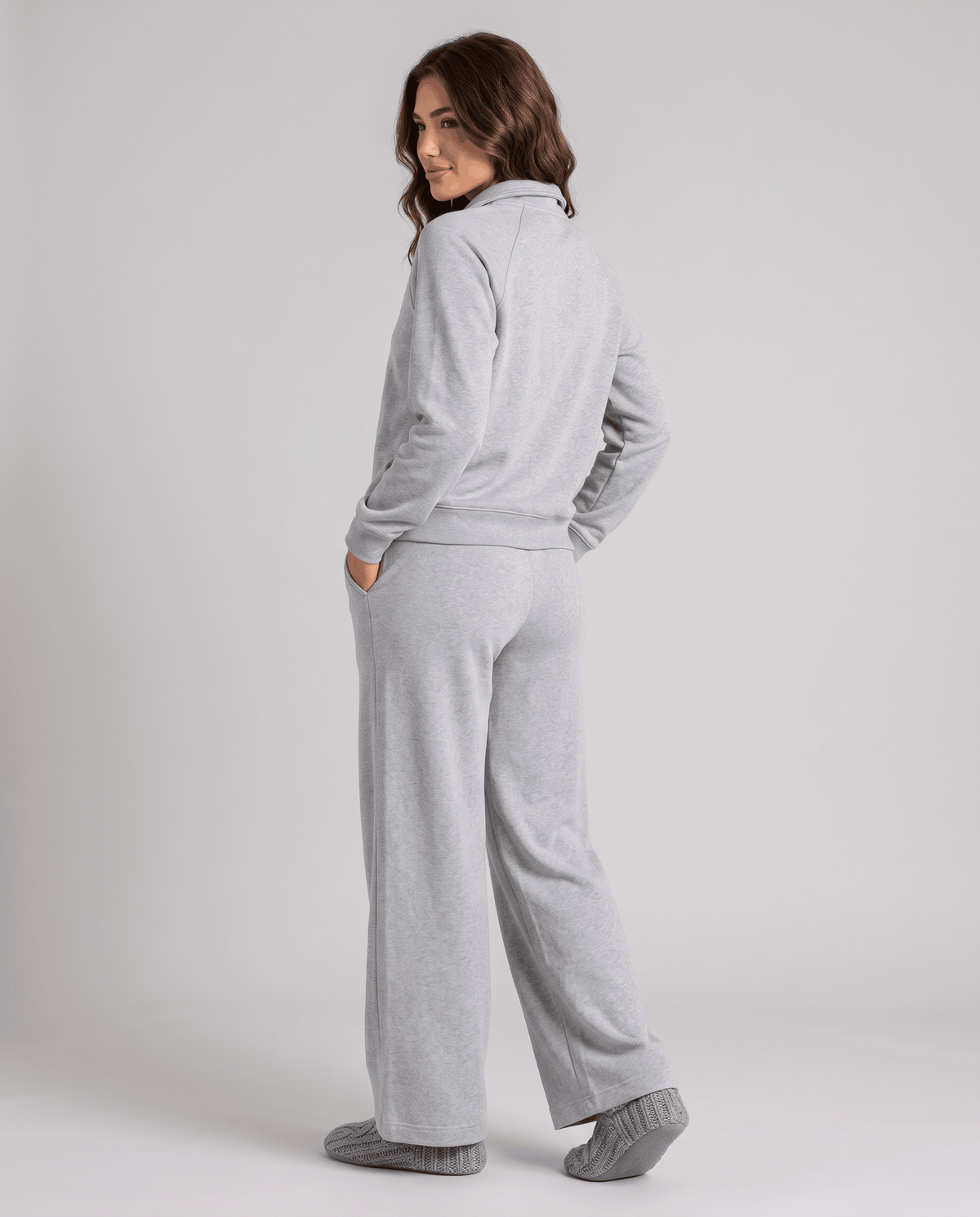 Back view of gray long-sleeve top and wide-leg pants