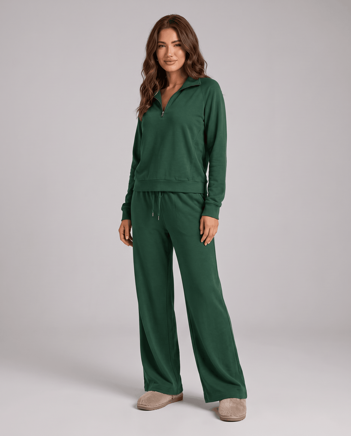 Woman in a green half-zip lounge set with wide-leg pants, full-length front view