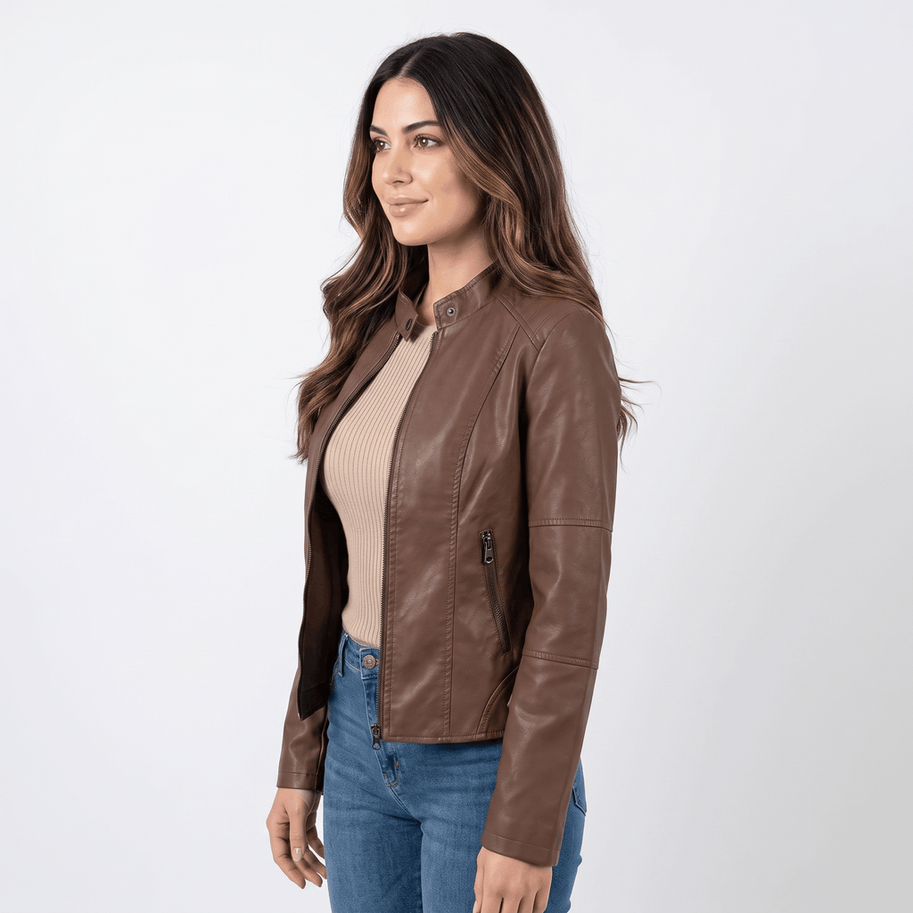 Side view of a woman wearing a brown faux leather jacket with a sleek fitted silhouette and zip-front closure.