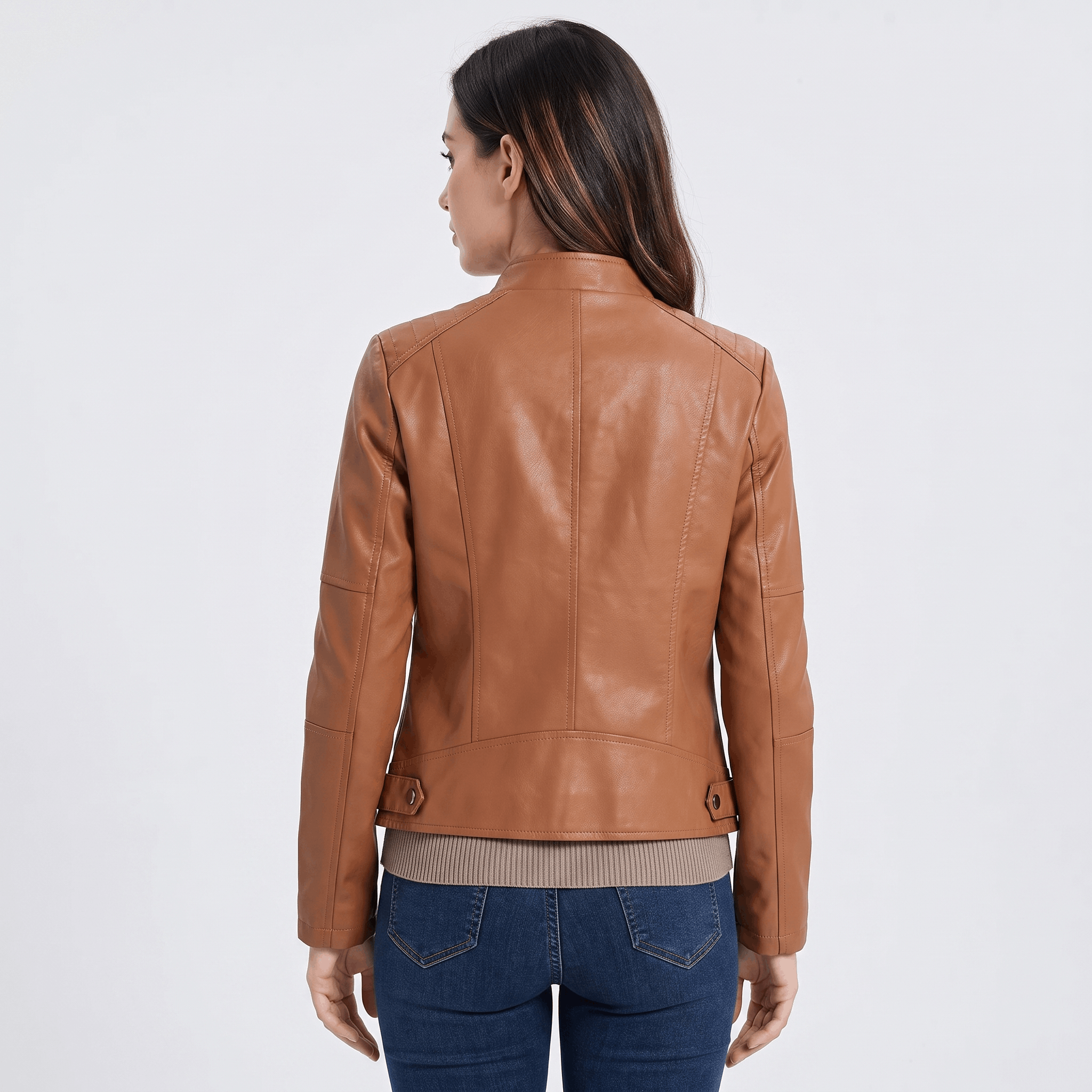 Back view of a women's camel faux leather jacket with a clean minimalist design and fitted silhouette.