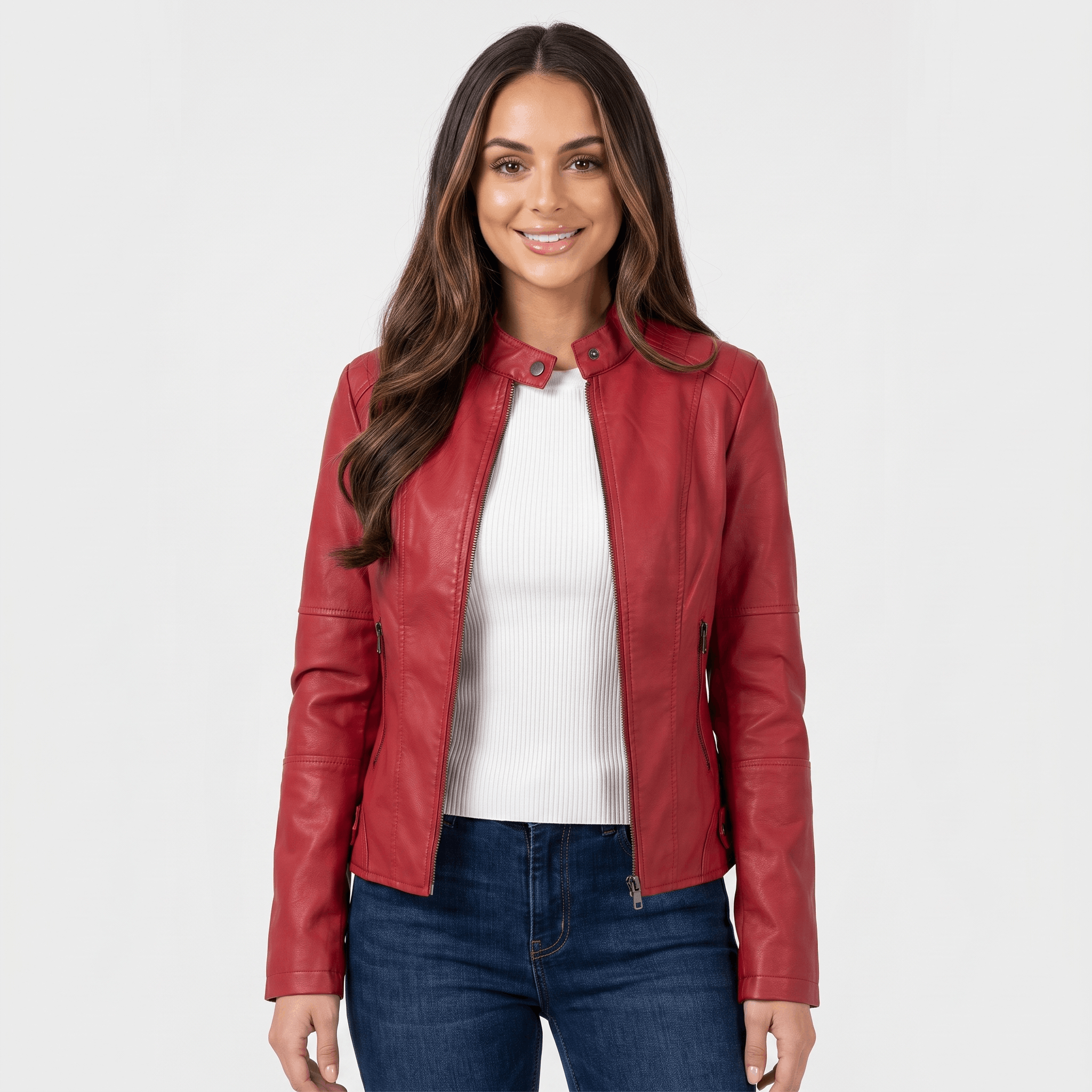 Woman wearing a red faux leather jacket with a zip-front closure, fitted silhouette, and long sleeves over a white top.