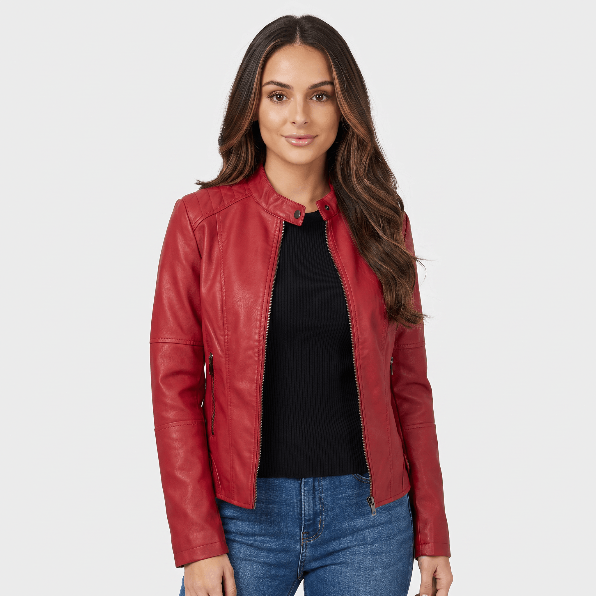 Woman wearing a red faux leather jacket with a zip-front closure, round neckline, and tailored fit over a black top.