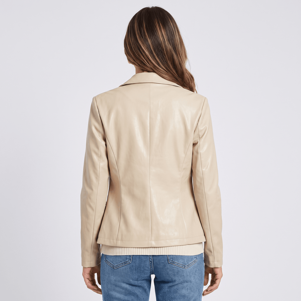 Back view of a women's beige faux leather blazer featuring a structured silhouette, long sleeves, and clean tailored design.