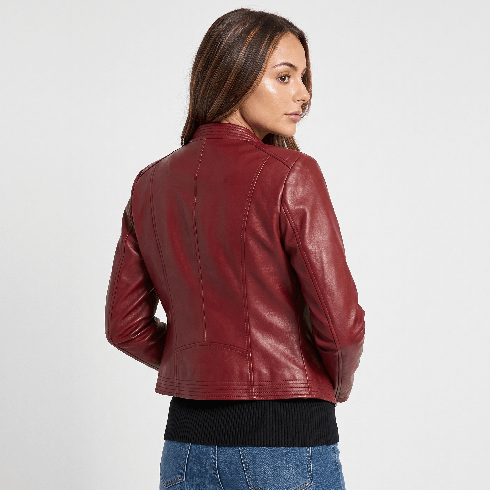 Back view of a women's burgundy leather moto jacket with a tailored fit, smooth finish, and long sleeves.