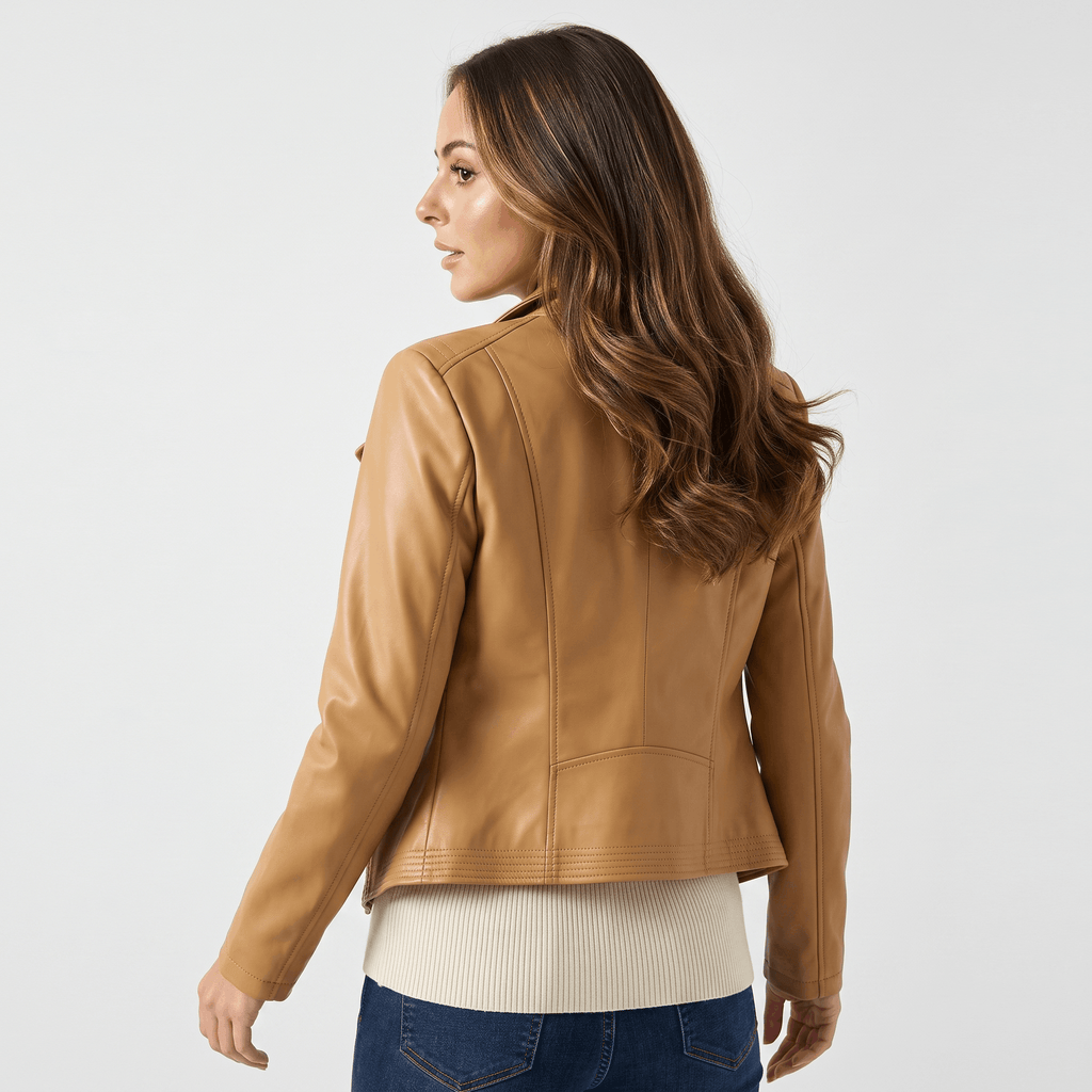Back view of a women's camel leather moto jacket featuring a smooth faux leather finish and fitted design.