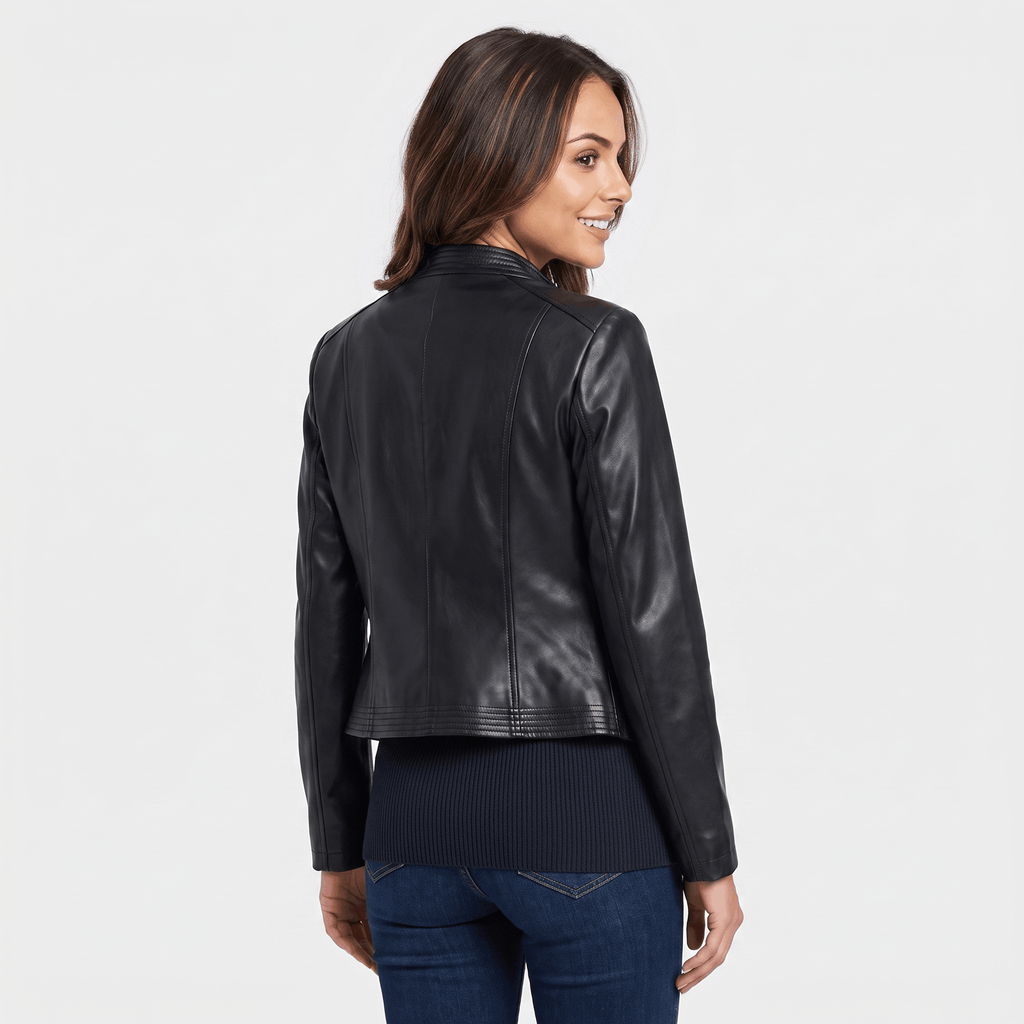 Back view of a women's black leather moto jacket with a cropped silhouette and classic moto styling.
