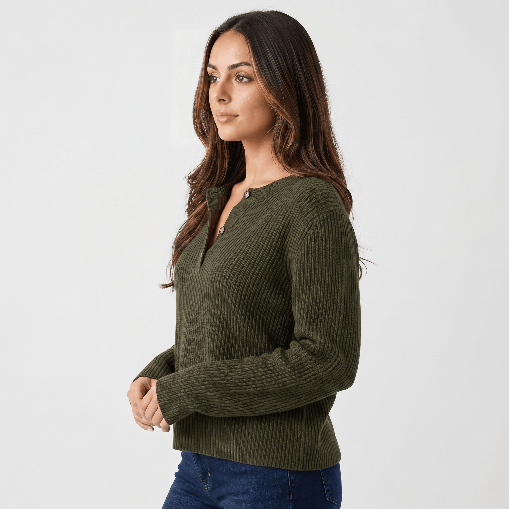 Side view of a woman wearing an olive green ribbed henley sweater with a fitted silhouette and long sleeves.