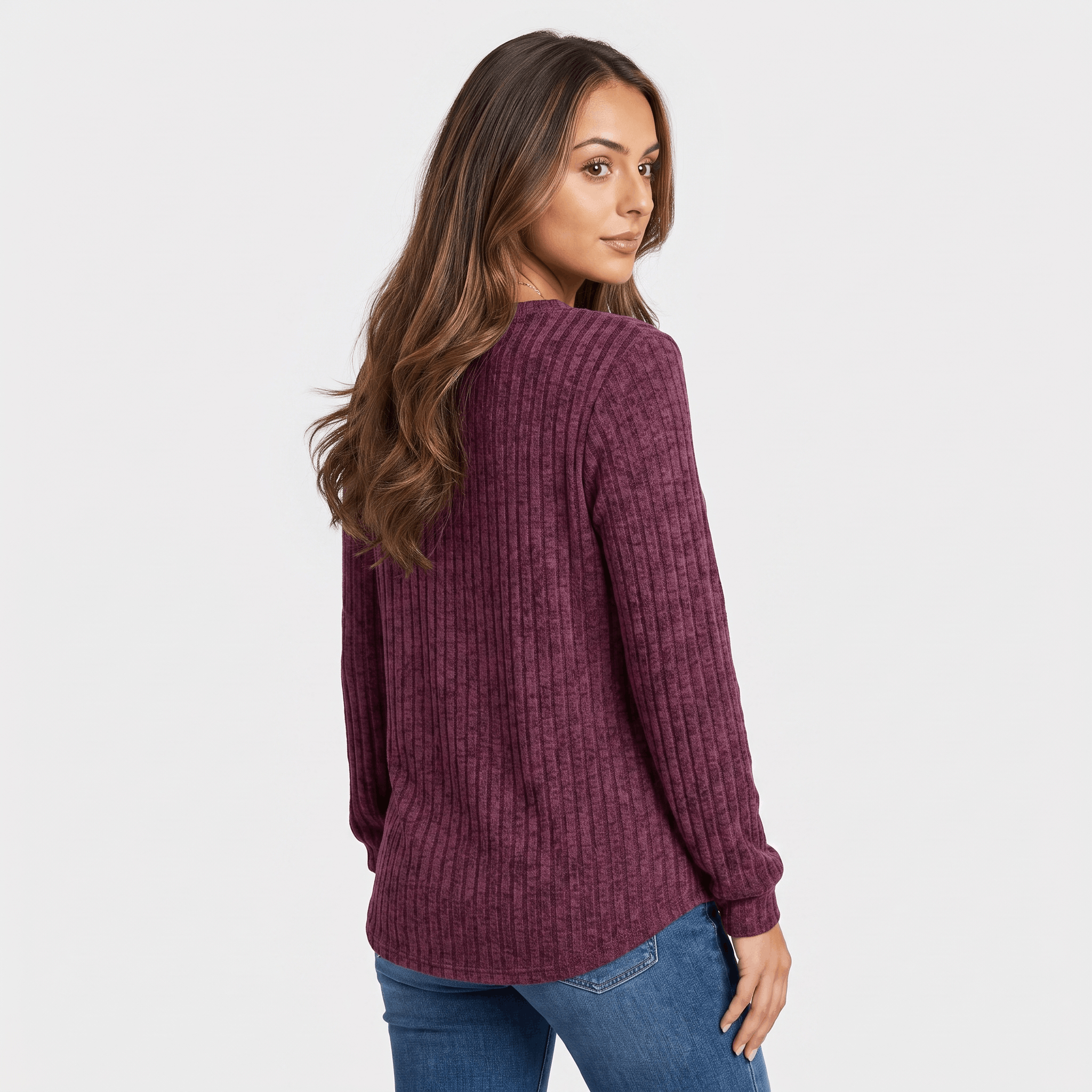 Back view of a woman wearing a burgundy textured henley sweater with a relaxed fit and long sleeves.