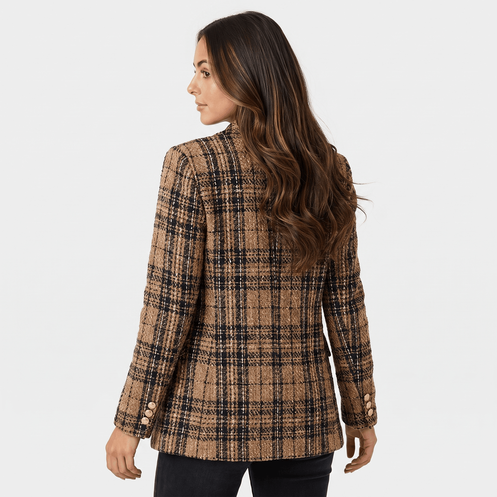 Back view of a woman wearing a brown plaid tweed blazer with a tailored fit and long sleeves.