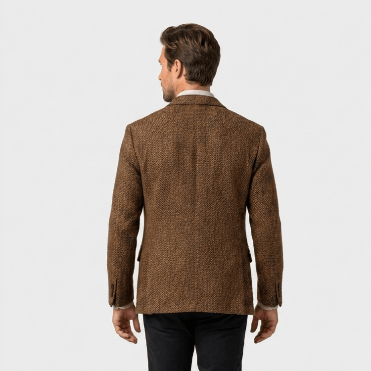 Back view of a man wearing a brown textured blazer with a tailored fit and classic structured design.