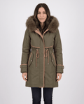 Olive green plush hood trim winter parka with belted waist and front pockets worn by a female model