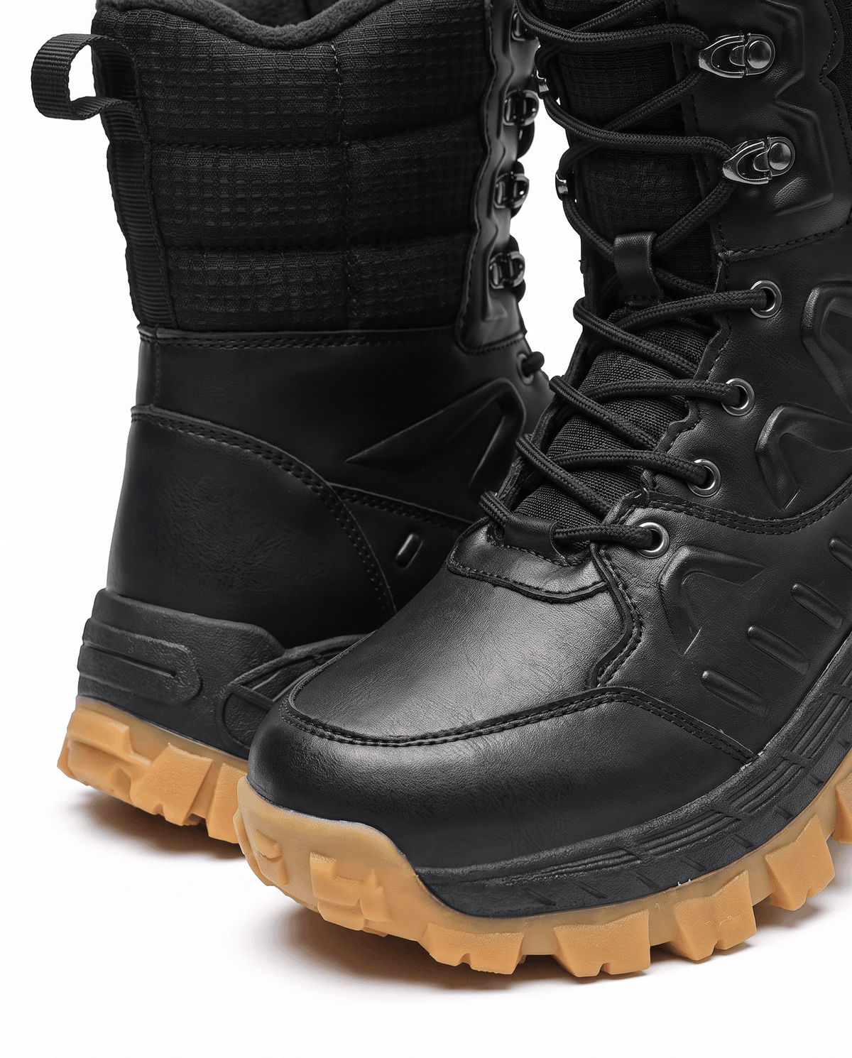Close view of two black boots showing lace-up fronts and padded collars